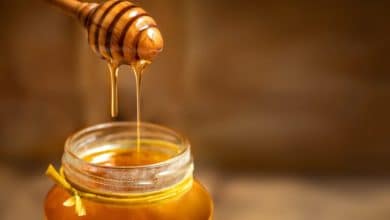 Honey in a glass jar with honey dipper 768x562 1